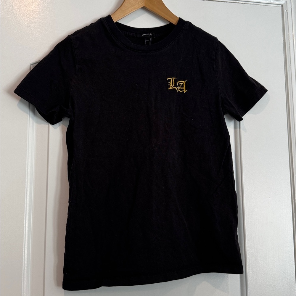 Forever 21 Black Short Sleeve Tee w/ “LA” gold letters size medium